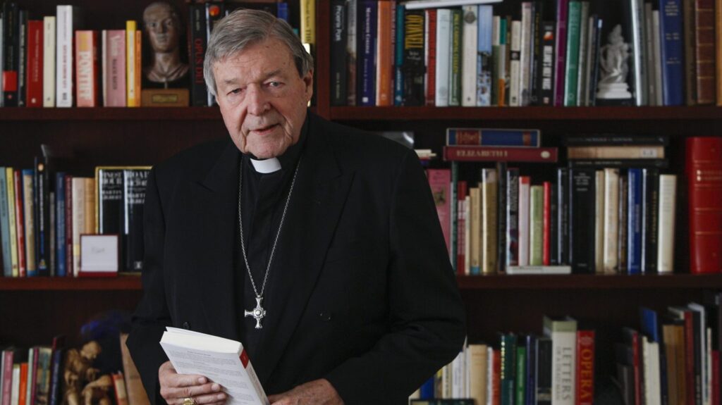 Australian Cardinal George Pell holds a copy of his book, "Prison Journal," during an interview with Catholic News Service at his residence in Rome Dec. 18, 2020. Jesuit Father Frank Brennan, an Australian legal scholar, said he believes the proceedings against Cardinal Pell were the result of a political vendetta against the prelate. (CNS photo/Robert Duncan)