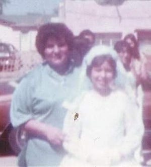 Rose Marie Wiseman is pictured with her aunt Lupe following her first Holy Communion at Our Lady of Health Parish in Las Cruces in 1978