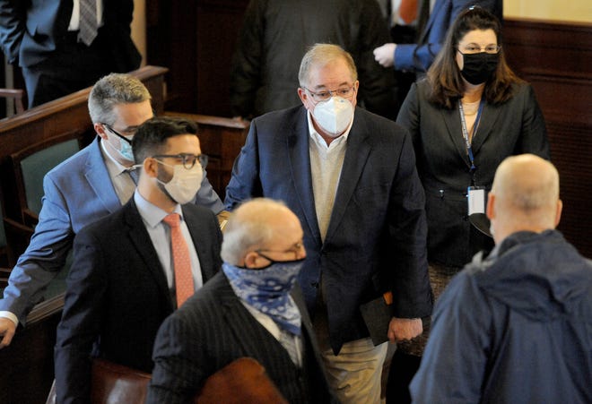 Mark Hession, left, walks into Barnstable Superior Court in January with his attorneys. - Merrily Cassidy/Cape Cod Times File