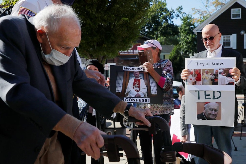 Former Roman Catholic cardinal Theodore McCarrick passes victims of clergy sexual abuse after facing charges of molesting a 16-year-old boy during a 1974 wedding reception at the district court in Dedham, Mass., on Sept. 3. (Brian Snyder / Reuters)