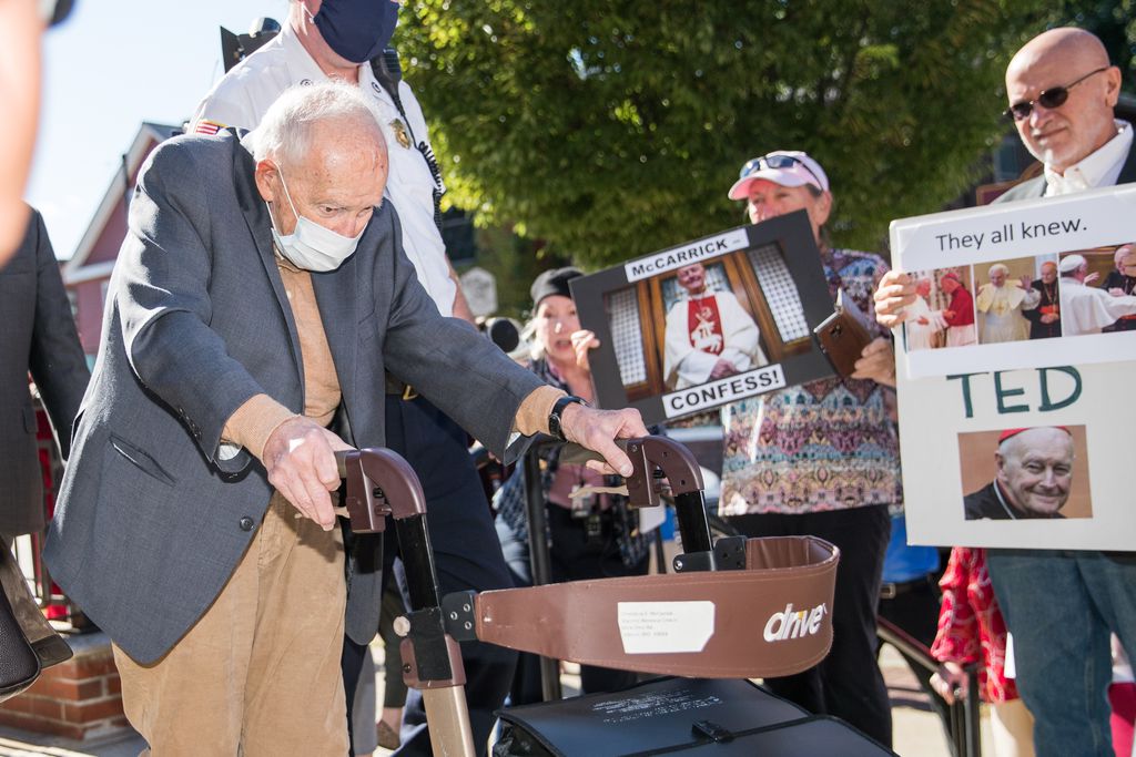 Former cardinal Theodore McCarrick, 91, passes protesters as he leaves the Dedham courthouse after pleading not guilty during his first appearance for sexual assault charges, on Sept. 3 in Dedham.SCOTT EISEN/GETTY