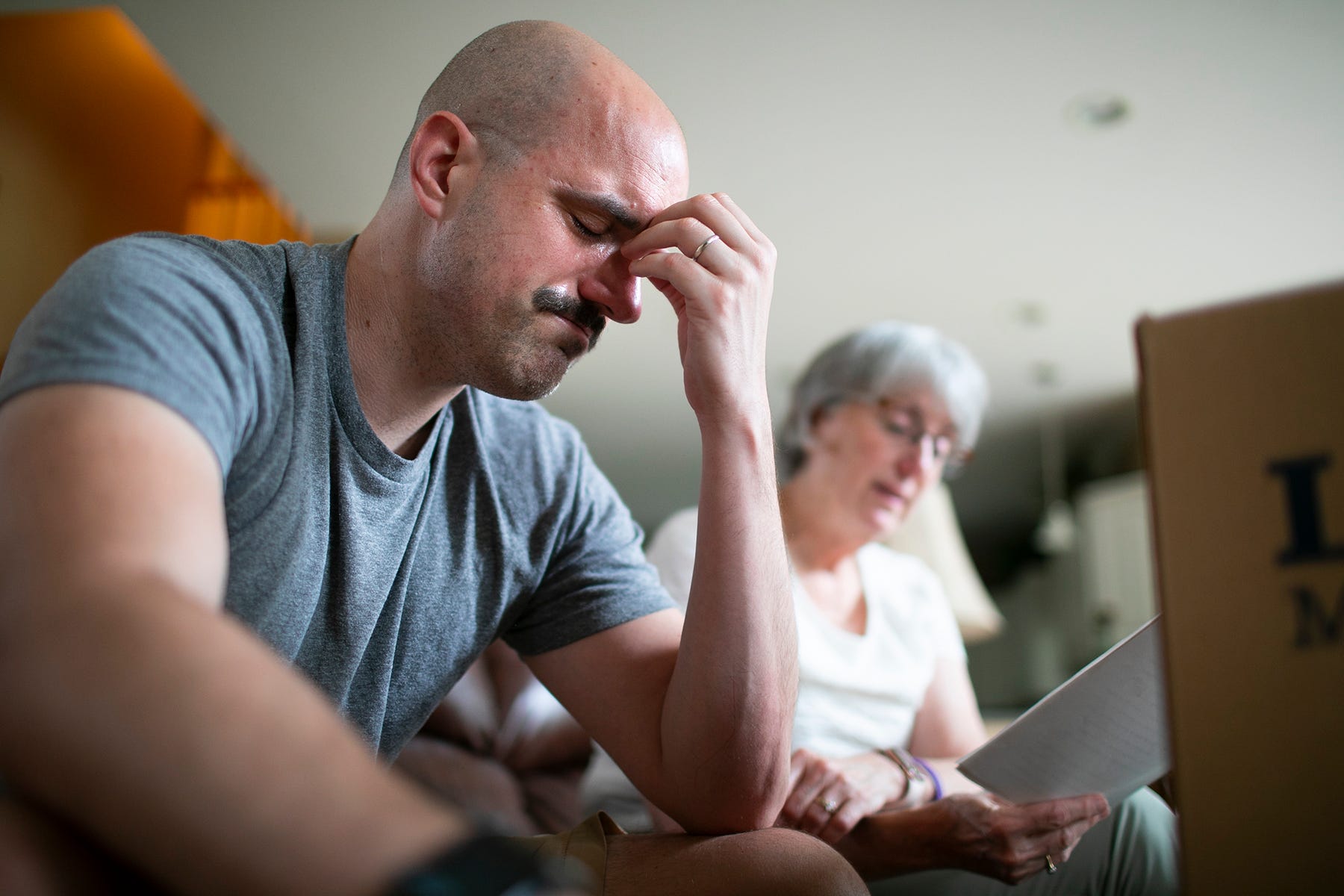 Hide caption Chris Graham cries as his mother, Lynne, reads an essay that he wrote about his faith while in college. Graham was emotional because he didn't remember his 1997 rape by the Rev. Raymond Lavelle at the time he wrote it. COURTNEY HERGESHEIMER/COLUMBUS DISPATCH