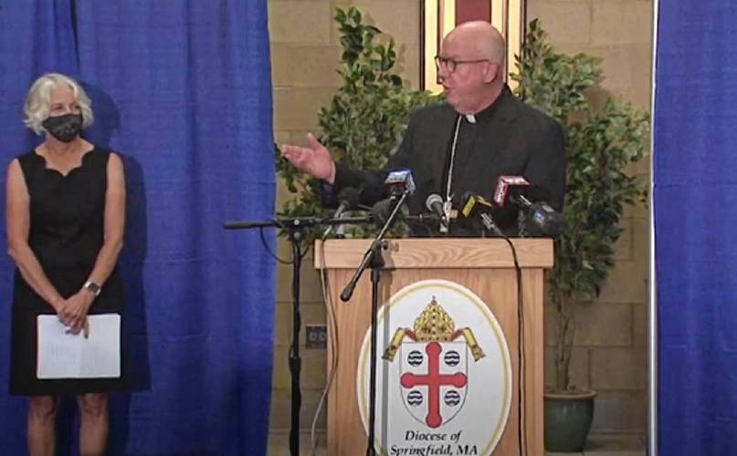 At a Wednesday press conference, Bishop William Byrne of the Roman Catholic Diocese of Springfield recognizes members of the Independent Task Force on the Response to Sexual Abuse, which issued a report recommending changes to the way the diocese handles allegations of sexual abuse within the church community. Irene Woods, co-chair of the task force, is seen at left. Brian Steele