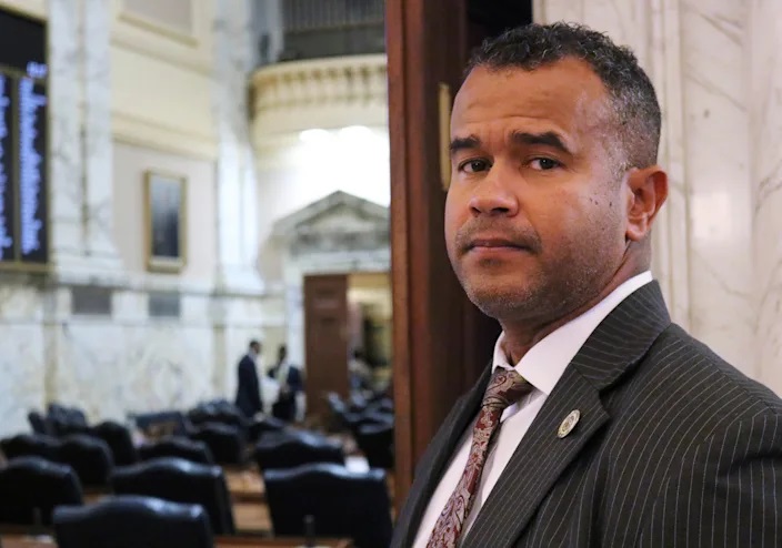 In this Feb. 28, 2019 photo, Del. C.T. Wilson stands outside the Maryland House of Delegates in Annapolis, Md. Wilson, a survivor of child sexual abuse who has spoken of his experience as he has advocated for laws to protect children, is sponsoring legislation in Maryland to prevent teachers with records of sexual misconduct against students from moving from one school to another.