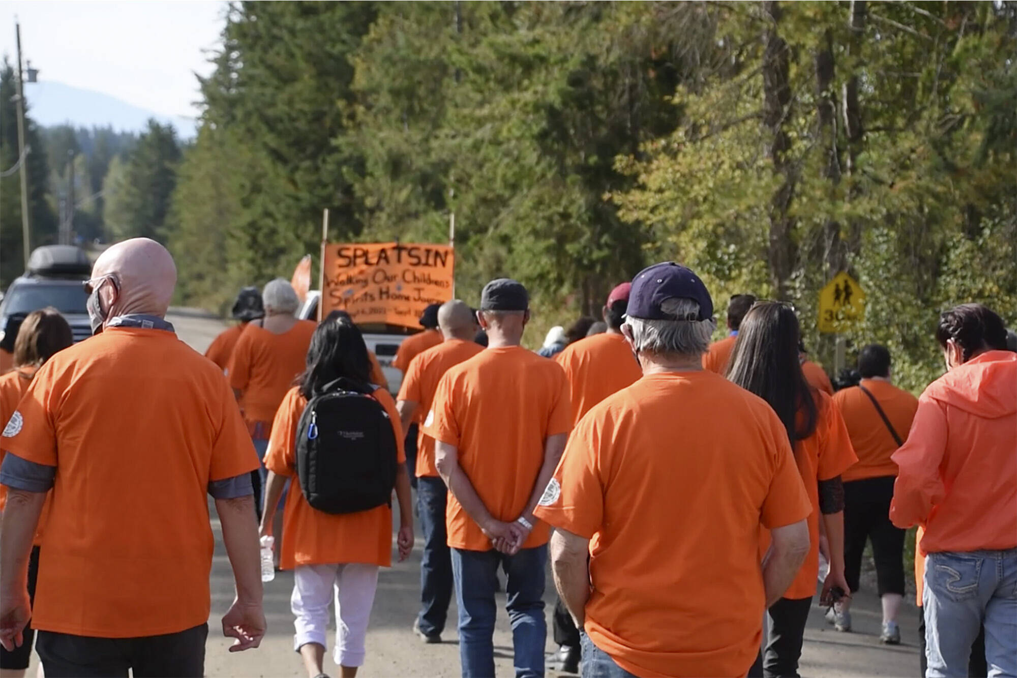 Splatsin members and their supporters walk on Sept. 10, 2021, the last day of the five-day Walking Our Children’s Spirits Home Journey from the Kamloops residential school. Here they were walking the spirits of the children who died in Kamloops to meet the spirits of children at Splatsin’s Shihiya School in order to join past, present and future. (Martha Wickett - Salmon Arm Observer)