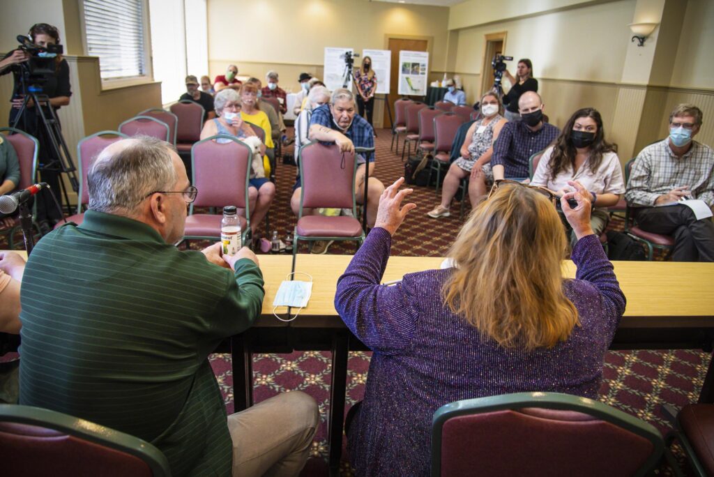 “We would never ask the Catholics of Vermont to stop attending Mass,” said survivor Maura Labelle, seated at right. “However, we hope that they will not put money in the collection baskets until these issues are truly resolved.” Photo by Glenn Russell/VTDigger
