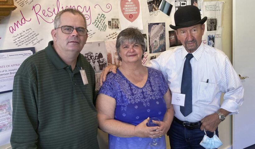 Michael Ryan, of Buckingham, Va., Brenda Hannon, of Williston, Vt. and John Magnago, of Miami, from left to right, pose in South Burlington, Vt., during a reunion of orphans from the St. Joseph's Orphanage in South Burlington, Vt., Thursday, Sept. 16, 2021. Some of the residents of the long-closed Vermont orphanage want the Catholic Church to pay for therapy as they continue to recover from what they felt was the abuse most of which occurred more than half a century ago. (AP Photo/Wilson Ring