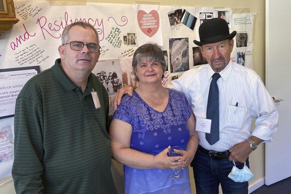 Michael Ryan, of Buckingham, Va., Brenda Hannon, of Williston, Vt. and John Magnago, of Miami, from left to right, pose in South Burlington, Vt., during a reunion of orphans from the St. Joseph's Orphanage in South Burlington, Vt., Thursday, Sept. 16, 2021. Some of the residents of the long-closed Vermont orphanage want the Catholic Church to pay for therapy as they continue to recover from what they felt was the abuse most of which occurred more than half a century ago. (AP Photo/Wilson Ring