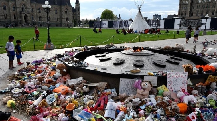 A memorial for children who died at residential schools is seen at the Centennial Flame on Parliament Hill in Ottawa. (Justin Tang / The Canadian Press)