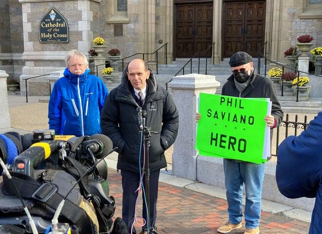Lawyer Mitchell Garabedian, center, addresses the media Monday outside the Cathedral of the Holy Cross in Boston the day after clergy sex abuse whistleblower and survivor Phil Saviano of Douglas died. Joining Garabedian is Terence McKiernan, left, president of BishopAccountability.org, and Skip Shea, an Uxbridge resident.