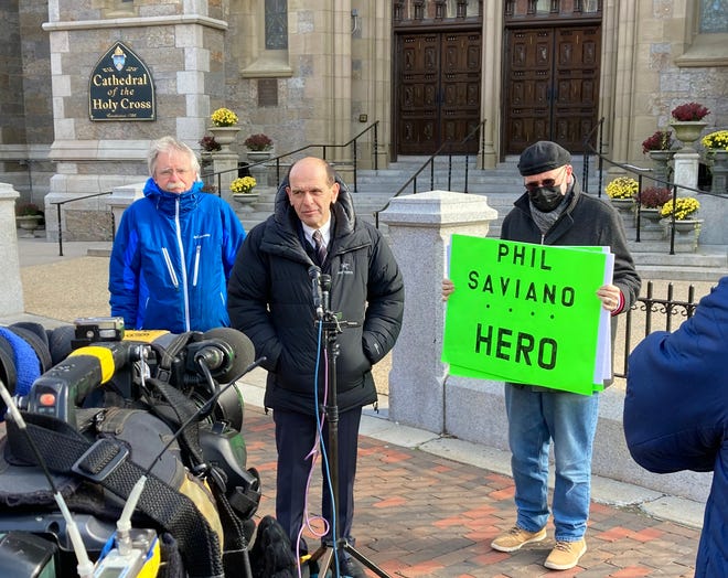 Lawyer Mitchell Garabedian, center, addresses the media Monday outside the Cathedral of the Holy Cross in Boston the day after clergy sex abuse whistleblower and survivor Phil Saviano of Douglas died. Joining Garabedian is Terence McKiernan, left, president of BishopAccountability.org, and Skip Shea, an Uxbridge resident.