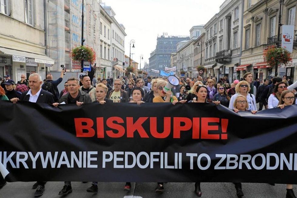 People take part during a demonstration against pedophilia, "Hands away from children," in Warsaw, Poland, Oct. 7, 2018. The banner reads, "Bishop, hiding pedophilia is a crime." (CNS / Agencja Gazeta via Reuters / Jacek Marczewski)
