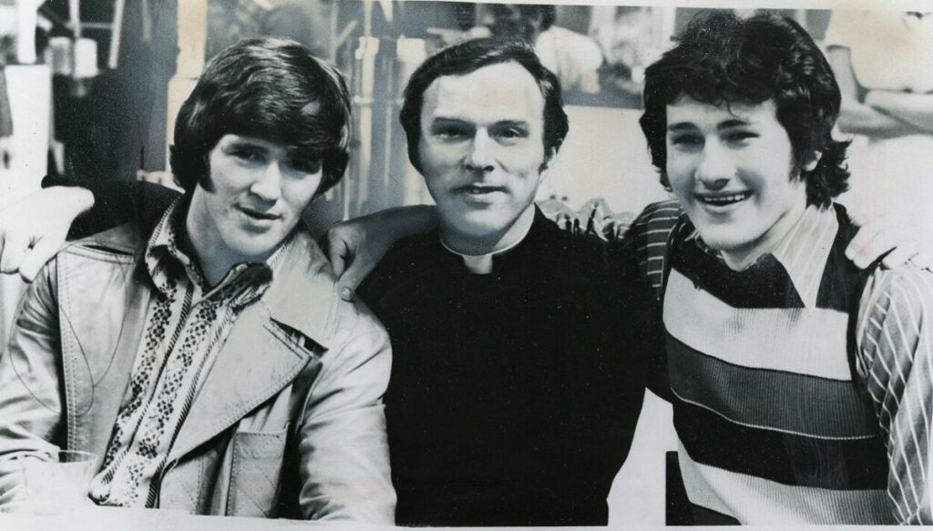 Rev. Ronald Sciera, middle, poses with Buffalo Sabres stars Rick Martin and Gilbert Perreault at Sciera's 40th birthday party on Nov. 10, 1974 in Buffalo. Sciera was the unofficial chaplain for the Sabres during that period.   Buffalo News file photo