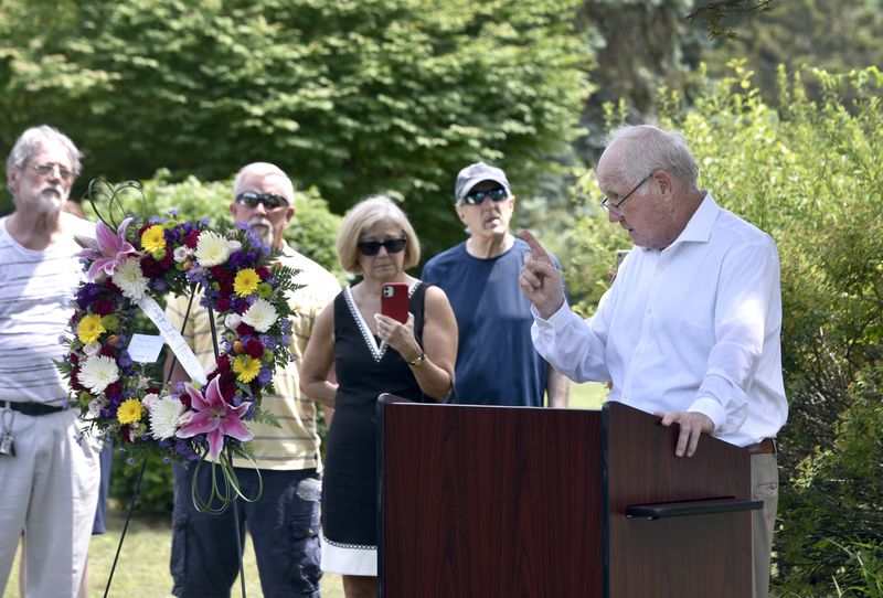 The Rev. James J. Scahill, right, a priest retired from the Roman Catholic Diocese of Springfield, speaks during June 28 graveside memorial service for Danny Croteau, the 13-year-old altar boy who authorities determined was killed by his parish priest, Richard Lavigne, in 1972. The service was held at the boy's grave in Hillcrest Cemetery in Springfield. Scahill, for the past 20 years, had been sounding the alarm about Lavigne and the questioning the diocese's handling of clergy sex abuse cases. (Don Treeger / The Republican File Photo)