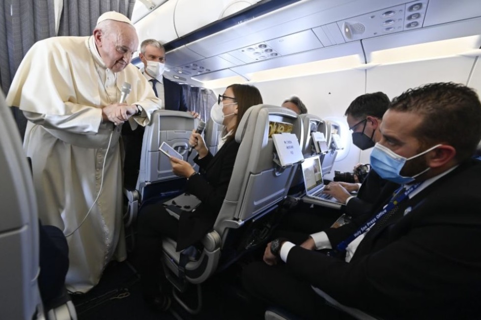 Pope Francis answers questions from journalists aboard his flight from Athens, Greece, to Rome Dec. 6, 2021. (CNS / Vatican Media)