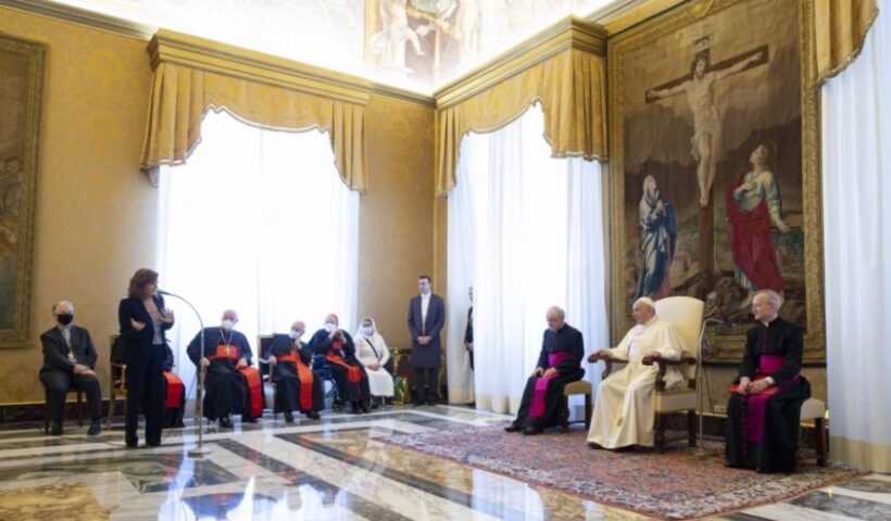 Pope Francis listens as Valentina Alazrak of Televisa speaks during a ceremony to honor Alazrak and journalist Philip Pullella of Reuters in the Apostolic Palace at the Vatican Oct. 13, 2021. (CNS / Vatican Media)