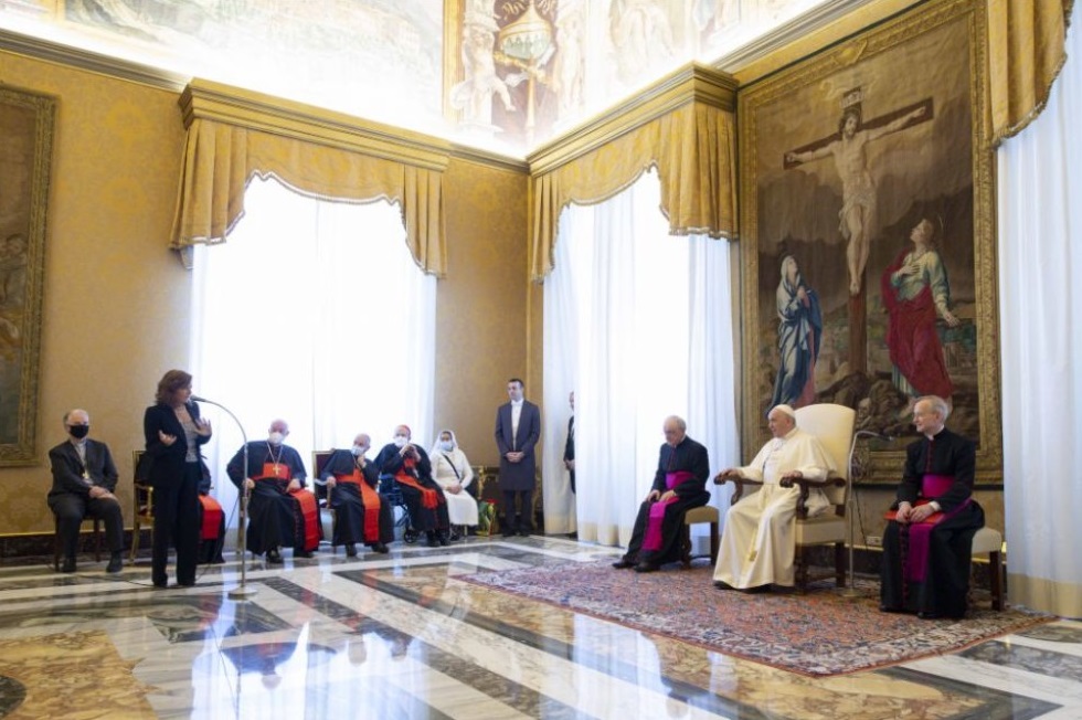 Pope Francis listens as Valentina Alazrak of Televisa speaks during a ceremony to honor Alazrak and journalist Philip Pullella of Reuters in the Apostolic Palace at the Vatican Oct. 13, 2021. (CNS / Vatican Media)