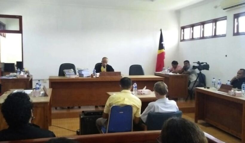 Defrocked American priest Richard Daschbach, center right, sits on the defendant's chair during his trial hearing at a court in Oecusse, East Timor, Tuesday, Dec. 21, 2021. Daschbach, who was accused of sexually abusing orphaned and disadvantaged young girls under his care in East Timor was found guilty Tuesday and sentenced to 12 years in prison, in the first case of its kind in the staunchly Catholic nation. (AP Photo / David dos Santos Gusmao)