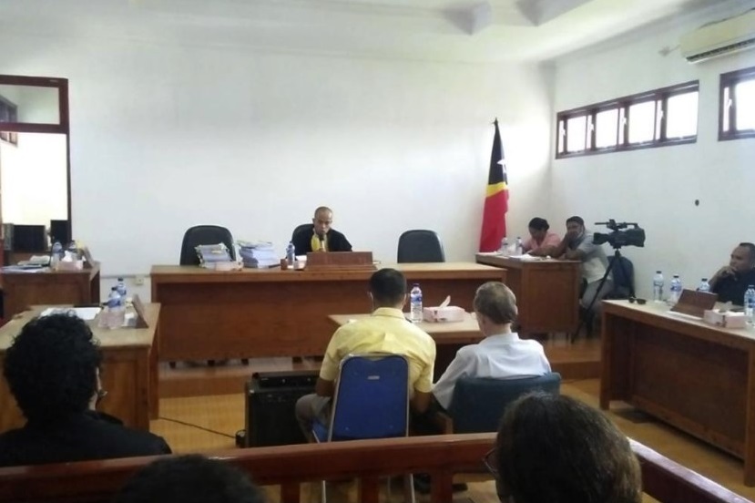 Defrocked American priest Richard Daschbach, center right, sits on the defendant's chair during his trial hearing at a court in Oecusse, East Timor, Tuesday, Dec. 21, 2021. Daschbach, who was accused of sexually abusing orphaned and disadvantaged young girls under his care in East Timor was found guilty Tuesday and sentenced to 12 years in prison, in the first case of its kind in the staunchly Catholic nation. (AP Photo / David dos Santos Gusmao)