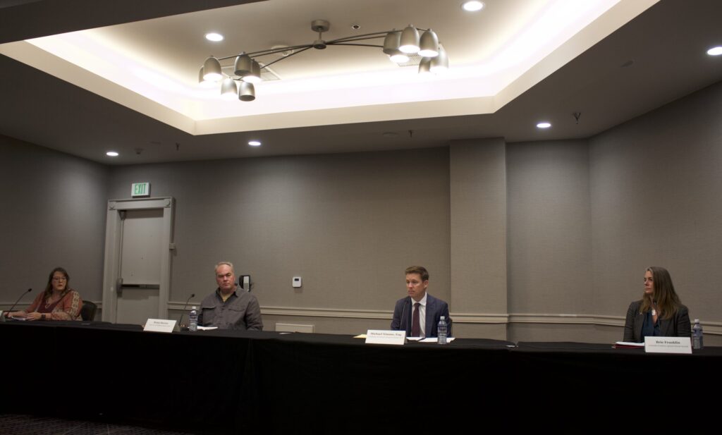 From left: Plaintiffs Meg Hargett and Brian Barzee; their attorney, Michael Nimmo; and Brie Franklin, the executive director of Colorado Coalition Against Sexual Assault, participate in a news conference at the Hyatt Regency Denver Tech Center on Nov. 18, 2021. (Faith Miller / Colorado Newsline)