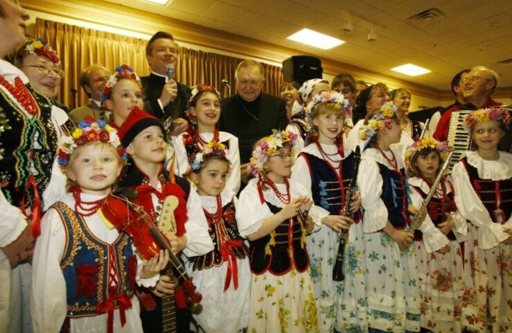 2007: The Rev. David Bialkowski of St. John Gualbert Catholic Church, blesses the instruments at the Pvt. Leonard Post Jr. Post in Cheektowaga. The young musicians are part of the Harmony Polish Folk Ensemble. By Robert Kirkham / Buffalo News
