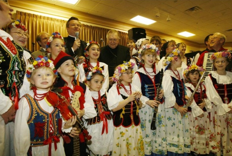 2007: The Rev. David Bialkowski of St. John Gualbert Catholic Church, blesses the instruments at the Pvt. Leonard Post Jr. Post in Cheektowaga. The young musicians are part of the Harmony Polish Folk Ensemble. By Robert Kirkham / Buffalo News