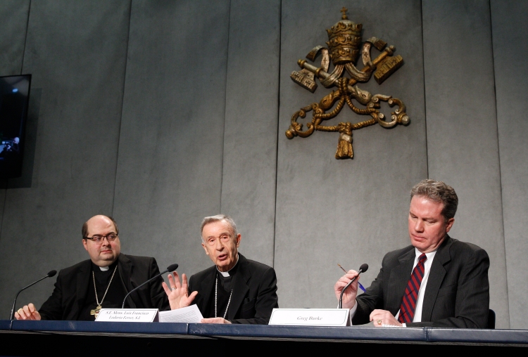 In a file photo, Archbishop Giacomo Morandi, secretary of the Congregation for the Doctrine of the Faith (left), is seen next to Cardinal Luis Ladaria, prefect of the Congregation for the Doctrine of the Faith, and Greg Burke, then-Vatican spokesman, March 1, 2018. (Credit: Paul Haring/CNS.)