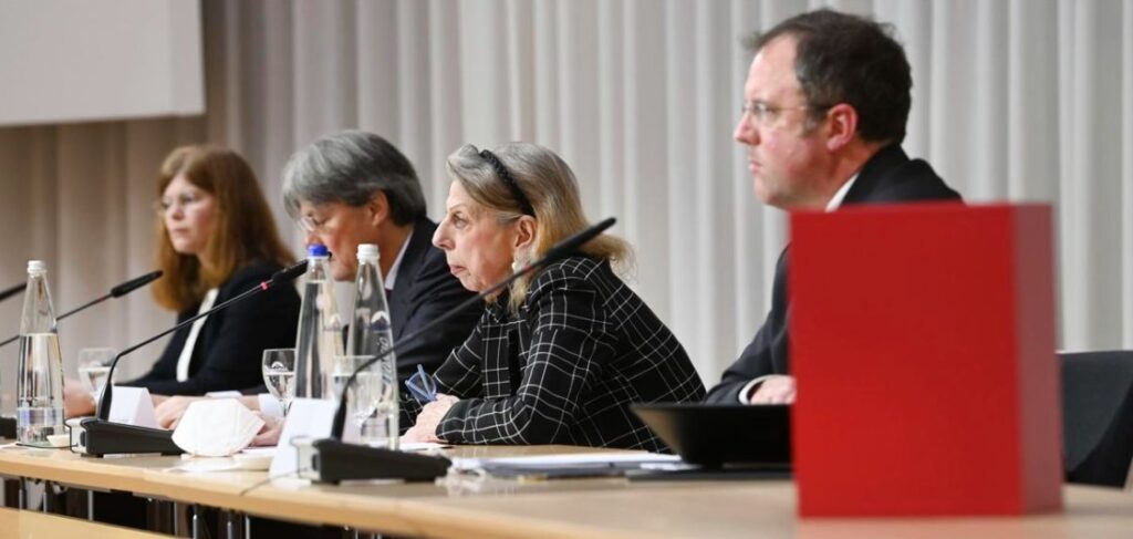 Barbara Leyendecker, Ulrich Wastl, Marion Westpfahl and Martin Pusch, from left, from the Munich law firm Westpfahl Spilker Wastl at the presentation of the expert report on cases of sexual abuse in the Catholic Archdiocese of Munich and Freising in Munich, Germany, Thursday, Jan. 20, 2022. The diocese of Munich had commissioned the law firm with the expert opinion on the abuse cases. (Sven Hoppe / dpa via AP, Pool)