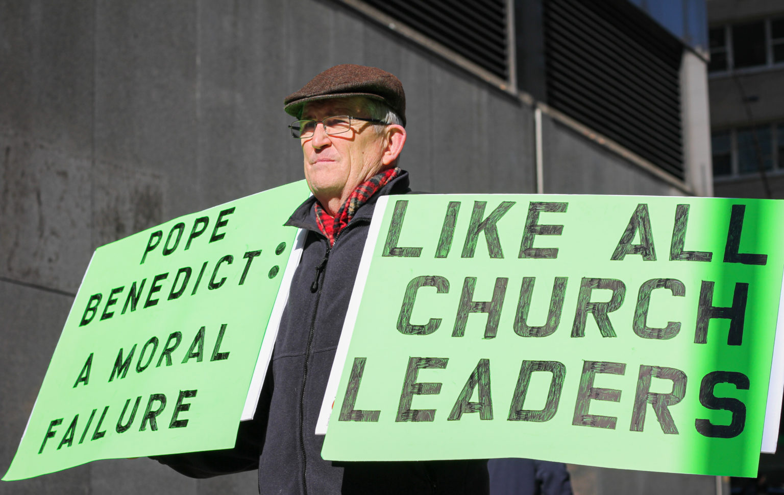 [Photo above: Former clergyman, Robert Hoatson, protests outside the Manhattan business offices of the Archdiocese of New York in support of sexual abuse victims. His goal is to “stir the pot” and put pressure on church leadership to acknowledge predatory behavior. New York, NY. Feb. 9, 2022. Danielle Dawson for NY City Lens]