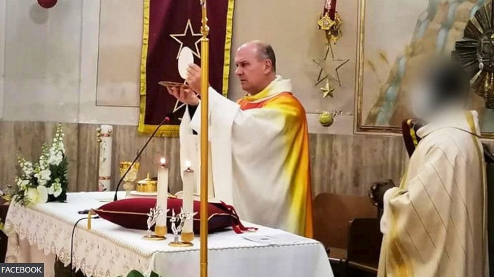 Father Gianni Bekiaris holds Mass