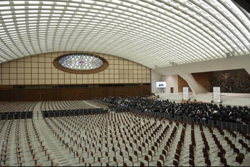 Faithful gather in the Paul VI hall to attend the opening of a 3-day Symposium on Vocations in the Paul VI hall at the Vatican, Thursday, Feb. 17, 2022. (AP Photo / Gregorio Borgia)