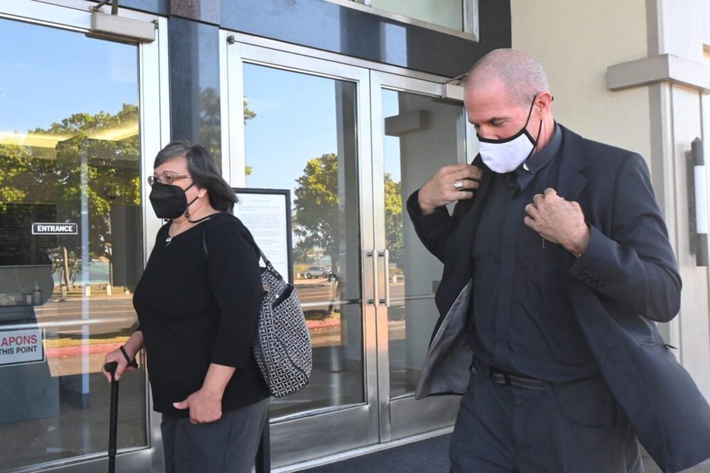 Archbishop Michael Jude Byrnes exits the U.S. District Court of Guam building Monday afternoon after he was called to the witness stand in a trial that would determine the extent of the assets that could be used to pay survivors of clergy sexual assaults. David Castro/The Guam Daily Post  Haidee Eugenio Gilbert