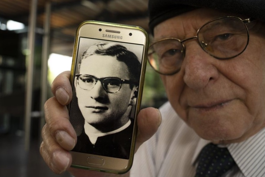 Jose Barba, one of the may victims in the Legion of Christ sex scandal, shows a photo of himself when he was a 18-year-old seminarian student, in Mexico City, Tuesday, Feb. 22, 2022. Barba was one of the first persons to come forward, accusing the disgraced founder of the Legion Father Marcial Maciel of sexual abuse before the Vatican. It has been 25 years since a Connecticut newspaper exposed one of the Catholic Church’s biggest sexual abuse scandals. And still some of the whistleblowers are seeking reparations from the Legion of Christ after reporting that the revered founder of the Legion of Christ religious order had raped and molested them when they were boys. (AP Photo / Marco Ugarte