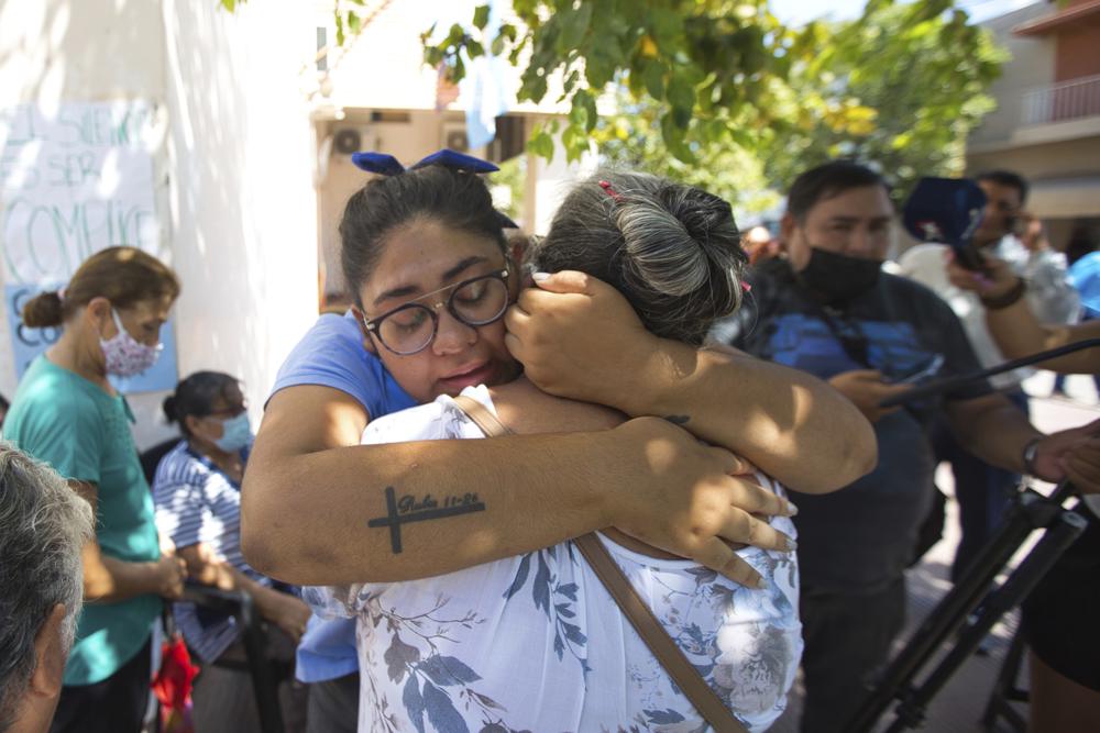 People react outside the court after Argentine Bishop Gustavo Zanchetta was convicted and sentenced to 4 1/2 years in prison for continued sexual abuse of two former seminarians in Oran, Argentina, Friday, March 4, 2022. (AP Photo/Javier CoP Photo/Javier Corbalan)