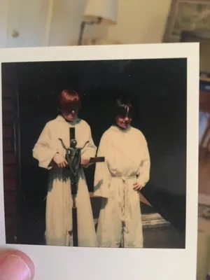David Ohlmuller, right, with his older brother, Brad, as an alter boy at St. Cassian Roman Catholic Church in Montclair, New Jersey. David was abused as a boy by a Catholic priest. He recently rode his bicycle from Chicago to New Jersey to draw attention to the Catholic sex abuse crisis. The journey was chronicled in the documentary film, Peloton of One.