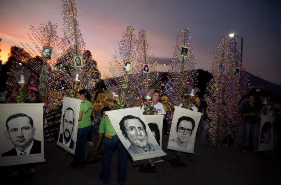 Banners depicting six Jesuit priests massacred in 1989 in El Salvador are displayed during a 2008 memorial to mark the anniversary of their deaths. AP Photo / Edgar Romero