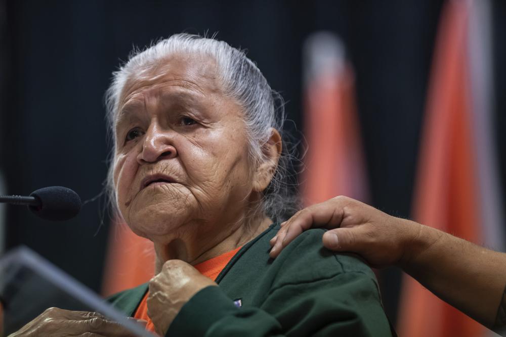 Kamloops Indian Residential School survivor Evelyn Camille, 82, pauses while speaking about her experience at the school after the Tk'emlúps te Secwépemc First Nation released a report outlining the findings of a search of the former residential school property using ground-penetrating radar, in Kamloops, British Columbia, on Thursday, July 15, 2021. The remains of 215 children have been found buried near the former school. (Darryl Dyck/The Canadian Press via AP, File)