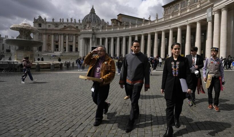 From left, Gerald Antoine, First Nations NWT Regional Chief, Natan Obed, President of Inuit Tapiriit Kanatami delegation, and Cassidy Caron, President of the Metis community, walk in St. Peter's Square, at the Vatican, after their meeting with Pope Francis, Friday, April 1, 2022. Pope Francis on Friday made a historic apology to Indigenous Peoples for the "deplorable" abuses they suffered in Canada's Catholic-run residential schools and said he hoped to visit Canada in late July to deliver the apology in person to survivors of the church's misguided missionary zeal. (AP Photo / Alessandra Tarantino)