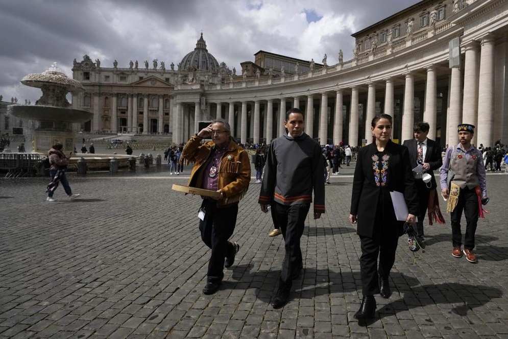From left, Gerald Antoine, First Nations NWT Regional Chief, Natan Obed, President of Inuit Tapiriit Kanatami delegation, and Cassidy Caron, President of the Metis community, walk in St. Peter's Square, at the Vatican, after their meeting with Pope Francis, Friday, April 1, 2022. Pope Francis on Friday made a historic apology to Indigenous Peoples for the "deplorable" abuses they suffered in Canada's Catholic-run residential schools and said he hoped to visit Canada in late July to deliver the apology in person to survivors of the church's misguided missionary zeal. (AP Photo / Alessandra Tarantino)