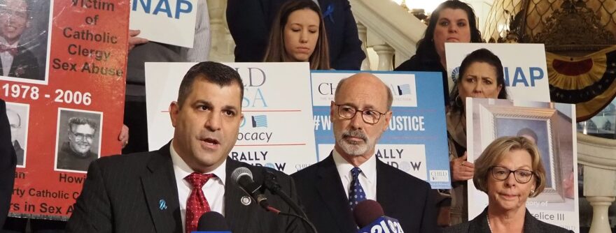 Rep. Mark Rozzi (D-Berks), left, speaks during an April 4, 2022 rally in Harrisburg on a bill that would open a new legal time window for survivors of child sexual abuse.