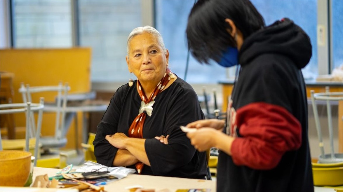 Dr. Denise Lajimodiere with student at Carleton College