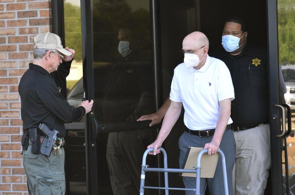 Paul West, center, is escorted by deputies from the Leflore County Civic Center in Greenwood, Miss., on Wednesday, April 13, 2022, after a jury found him guilty of sexually abusing a student at St. Francis of Assisi School in the 1990s. West, a former Franciscan friar, worked as a teacher and then principal at the Catholic school in Greenwood. Circuit Judge Ashley Hines sentenced West to 30 years on the first count and 15 years on the second. (Tim Kalich / The Commonwealth via AP)