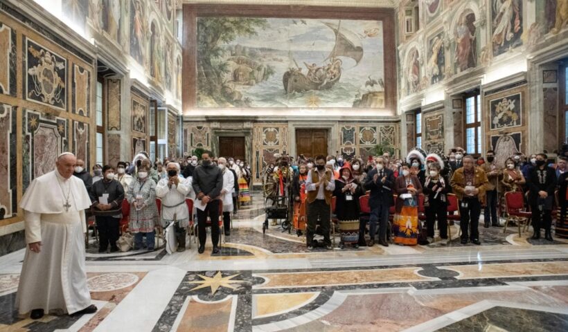 Indigenous delegates stand with Pope Francis after the Pontiff delivered an apology for the Catholic Church’s role in Canada's residential school system at the Vatican on April 1, 2022. HO-Vatican Media / The Canadian Press