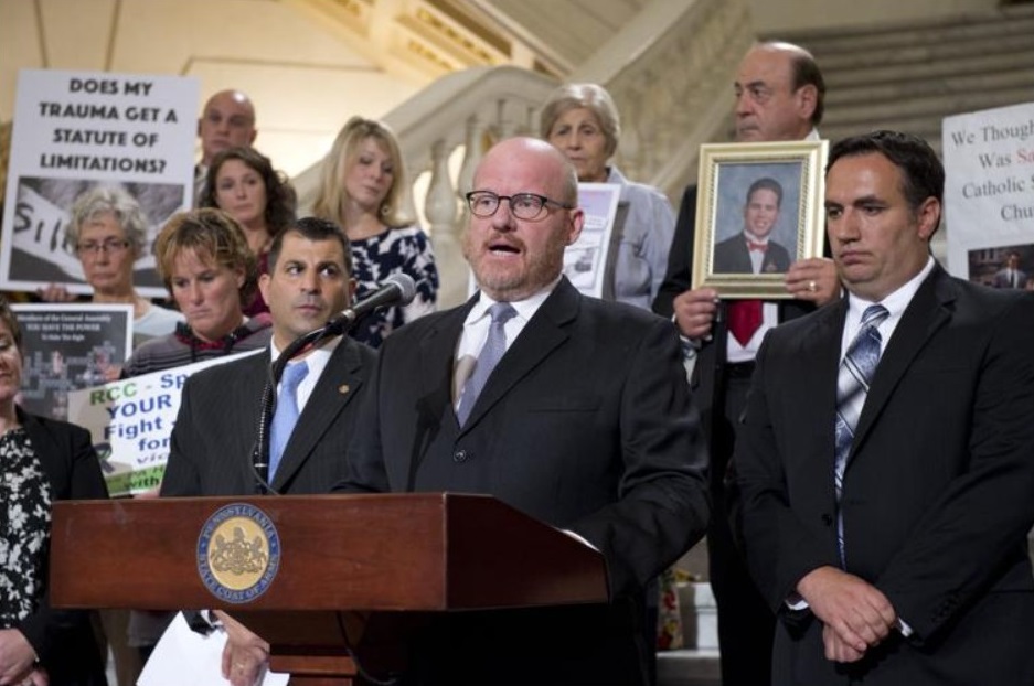 Shaun Dougherty (center), of Johnstown, speaks at a news conference on the statute of limitations reform for child sexual abuse on Tuesday, Sept. 27, 2016, at the Capitol in Harrisburg, flanked by state Rep. Frank Burns, D-East Taylor, (right) and Rep. Mark Rozzi, D-Berks (left). Submitted photo