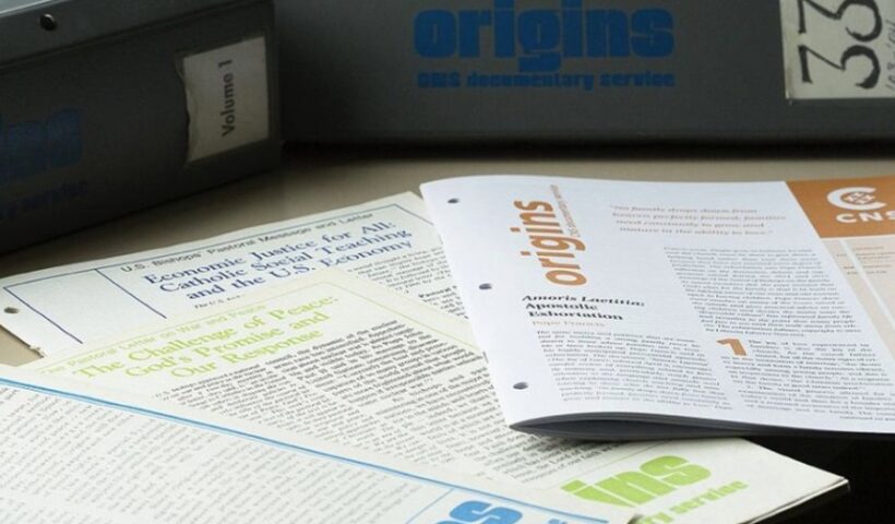 Some issues of Origins, the documentary service of Catholic News Service, are seen in this undated photo, along with binders for entire volumes of the publication. (CNS / Tyler Orsburn)