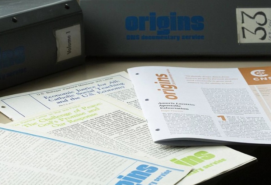 Some issues of Origins, the documentary service of Catholic News Service, are seen in this undated photo, along with binders for entire volumes of the publication. (CNS / Tyler Orsburn)