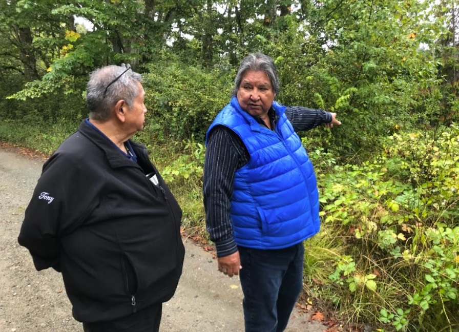 Tony, left, and James recently visited the site of the former Kuper Island Residential School with CBC reporter Duncan McCue. (Duncan McCue / CBC)