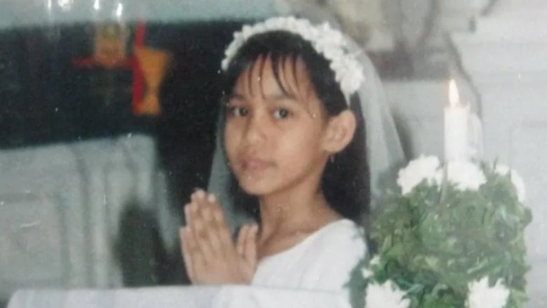 Alyssa Aco celebrates her first communion as a child in the Philippines. (Submitted by Alyssa Aco)