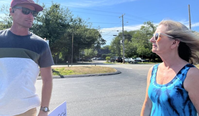 Ryan Brophy, who is protesting the assignment of a priest in Narragansett, is thanked by psychologist Ann Hagan Webb, a survivor of clergy sexual abuse. Phot by Amanda Milkovits