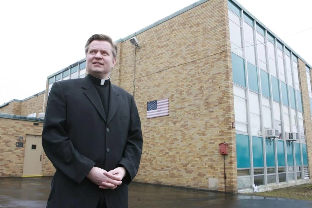 David M. Bialkowski stands outside St. John's Church in Buffalo on March 31, 2008. Buffalo News file photo